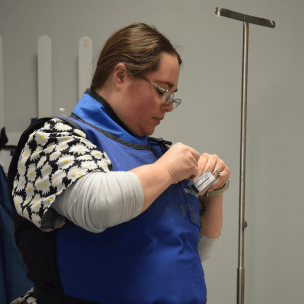Vet staff with an orange cat