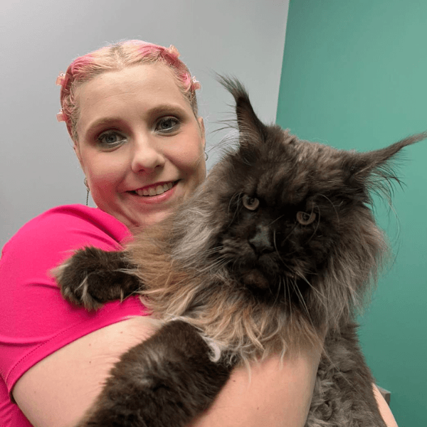 Vet staff Erin holding a cat